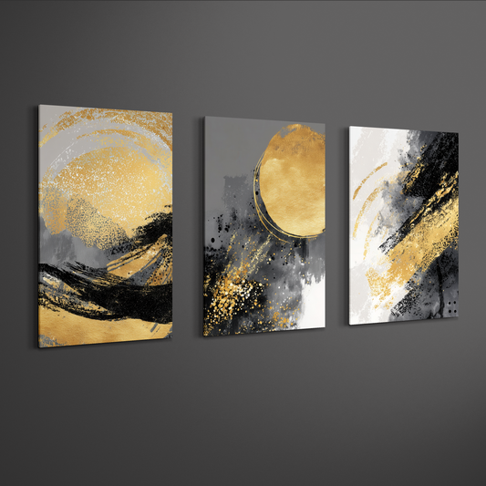 Angled mockup of black, grey and gold abstract triptych canvas art on neutral wall — contemporary decorative art.