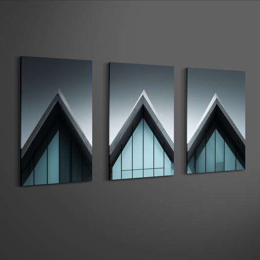 Perspective view of three panel architectural roofline artwork showing sharp triangular geometry and reflective glass facade