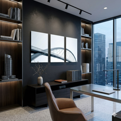 Three panel minimalist bridge photography wall art installed in modern executive office with city skyline view, smooth aluminum prints enhancing sophisticated workspace