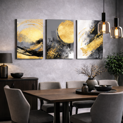 Black, grey and gold abstract triptych canvas wall art hanging above table in a sitting room — modern decorative wall art.