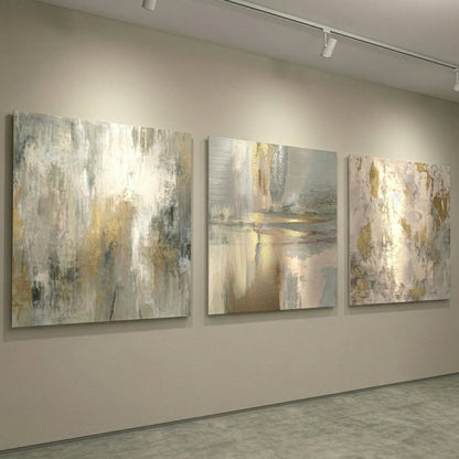 Three abstract paintings on a wall in a gallery setting