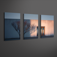 Angled side view of three panel minimalist architecture wall art printed on smooth aluminum, floating effect with clean spacing on neutral wall
