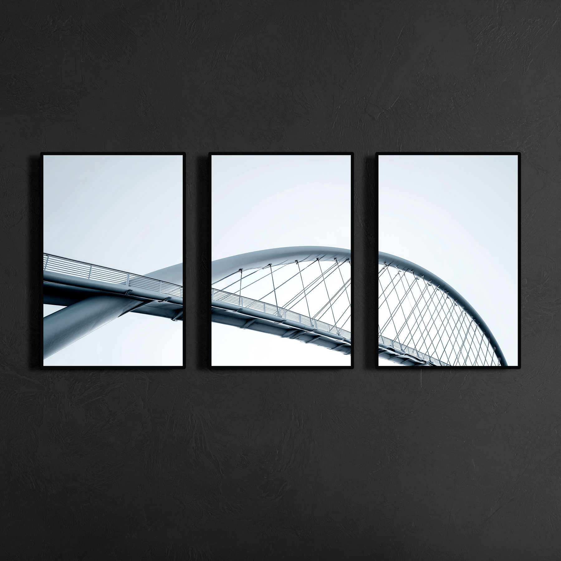 Three panel minimalist bridge architecture wall art with slim black metal frames mounted on charcoal textured wall, modern geometric design for refined interiors