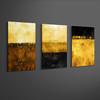 Angled view of gold and black abstract geometric triptych canvas art on neutral wall — modern décor piece.