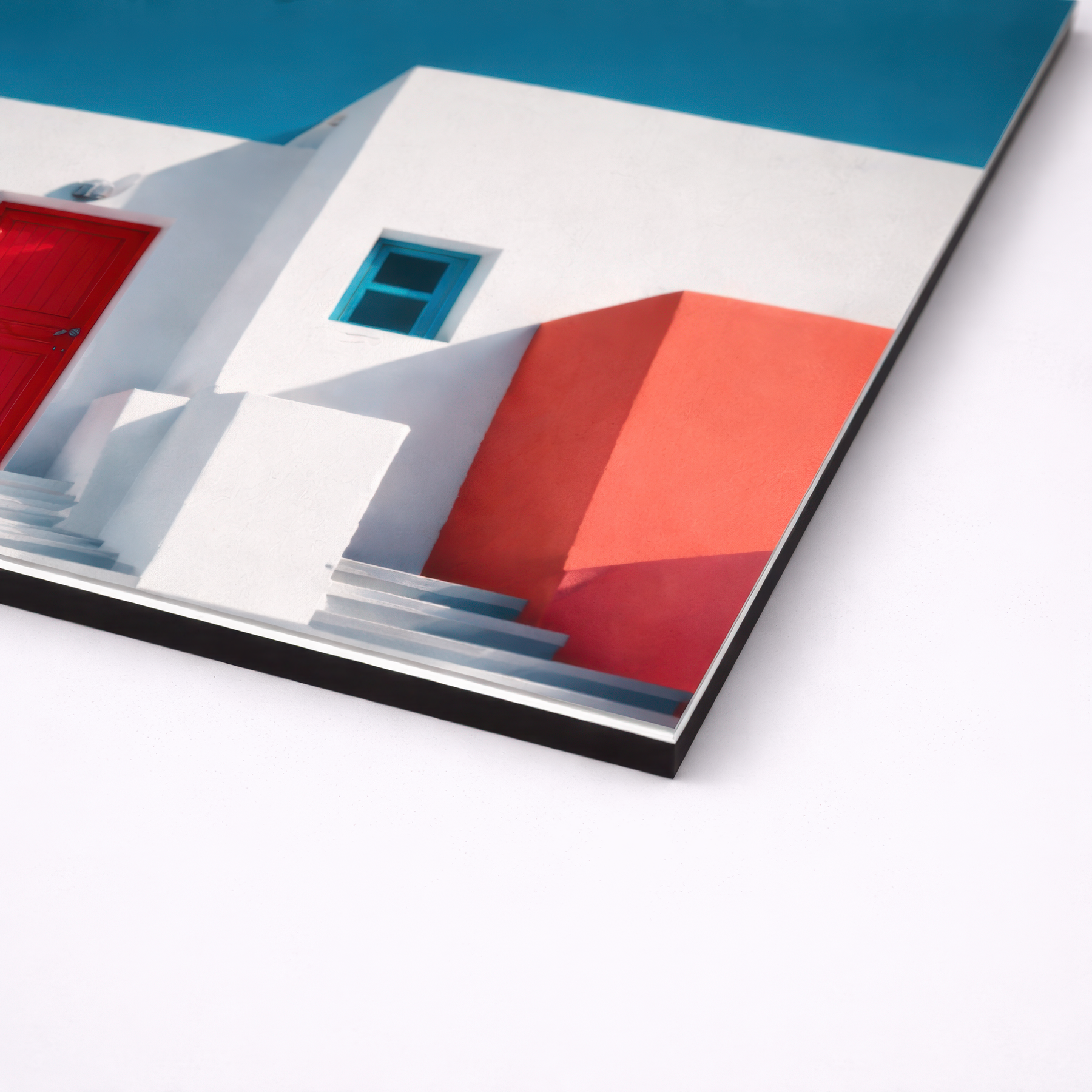 Close up angled view of colorful Mediterranean architecture wall art printed on smooth non brushed aluminum, sharp 3mm edge profile with metal finish