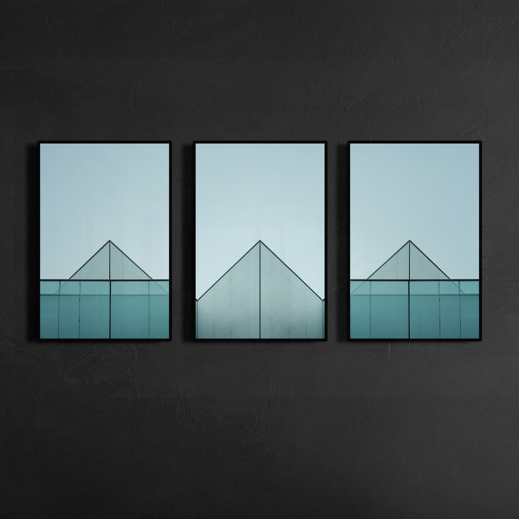 Three panel geometric glass building facade artwork mounted on dark charcoal wall highlighting symmetry and clean structural lines, installed in black metal frame, printed as matte poster