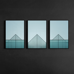Three panel geometric glass building facade artwork mounted on dark charcoal wall highlighting symmetry and clean structural lines, installed in black metal frame, printed as matte poster