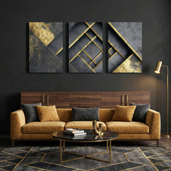 Black and gold geometric abstract triptych canvas art hanging above sofa in stylish living room — contemporary wall décor.
