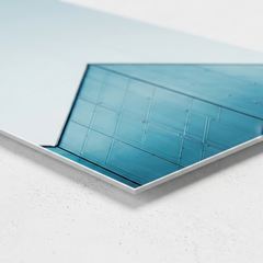 Close up corner detail of smooth non brushed aluminum wall art print showing slim 3mm edge and crisp architectural lines