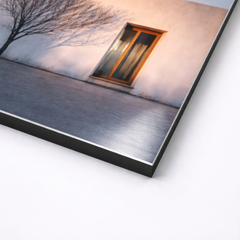 Close up angled view of minimalist architectural wall art printed on smooth non brushed aluminum, sharp black edge profile with slim 3mm thickness and matte surface finish